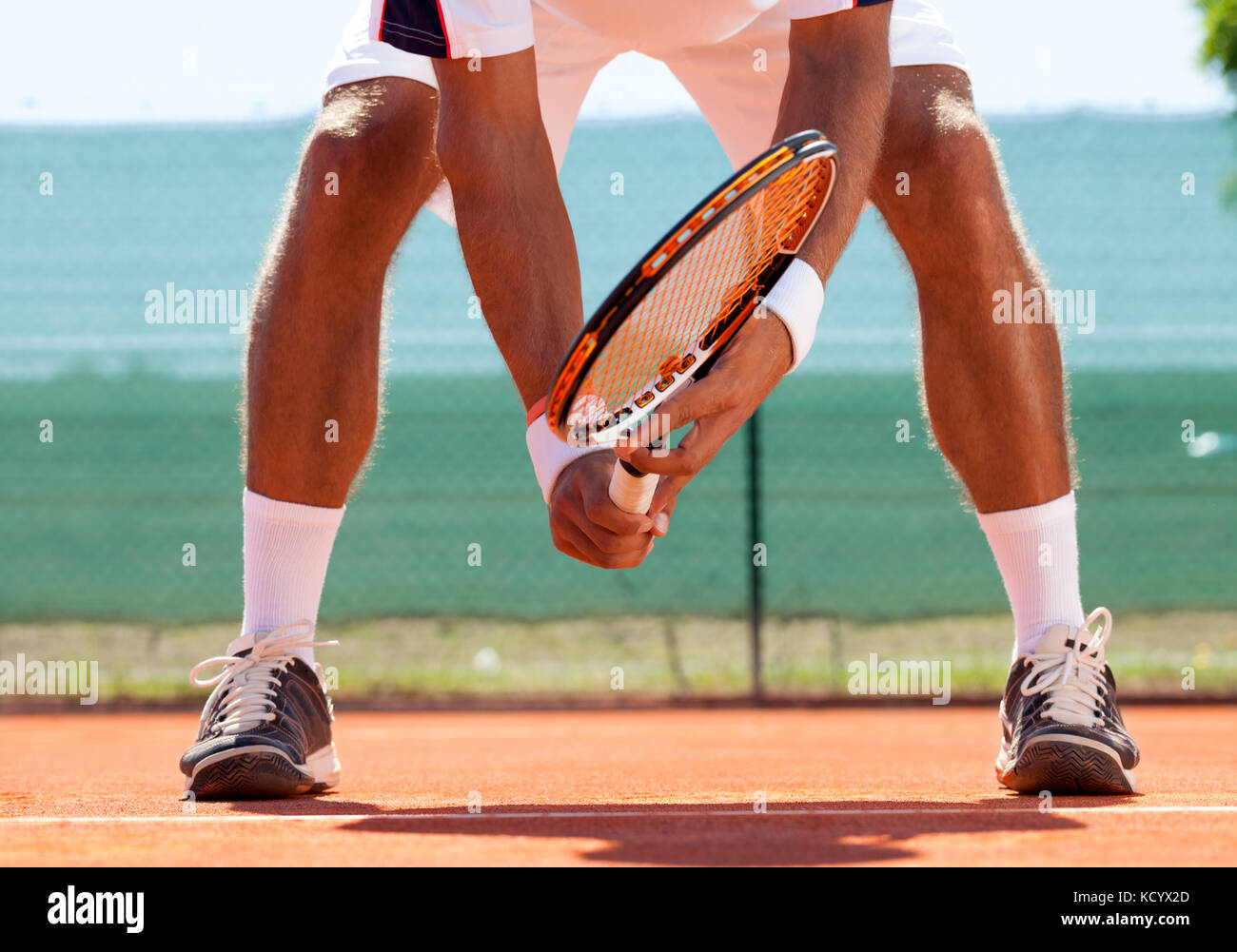 tennis court from low angle with Tennis player in action. Stock Photo
