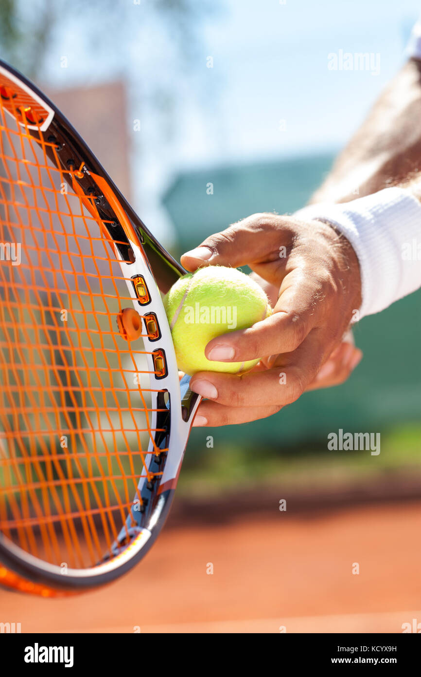 Tennis ball hitting racket close up hires stock photography and images