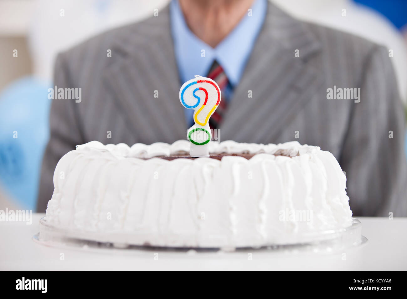 birthday cake with a question mark candle Stock Photo Alamy