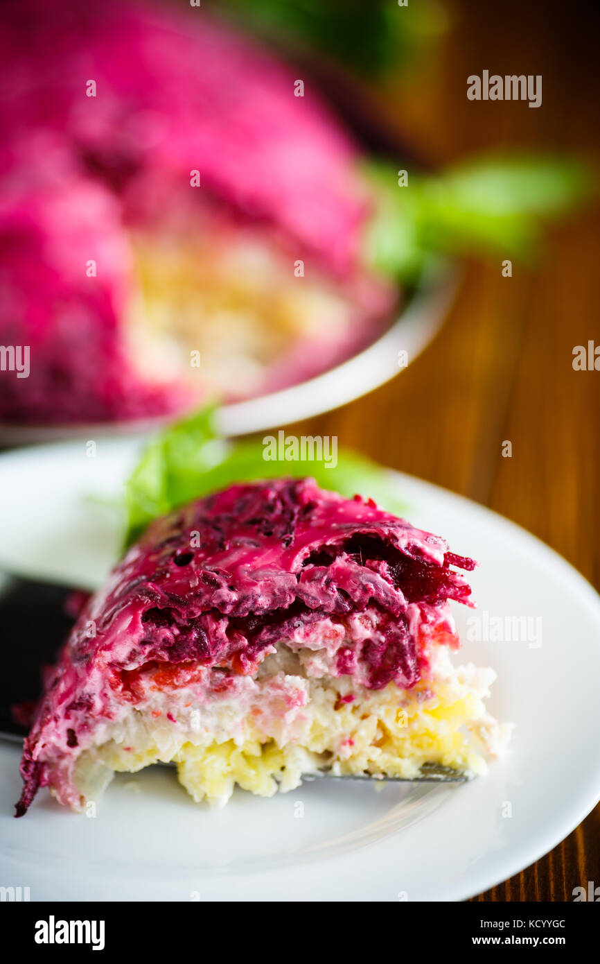 layered pastry salad with herring and beetroot Stock Photo