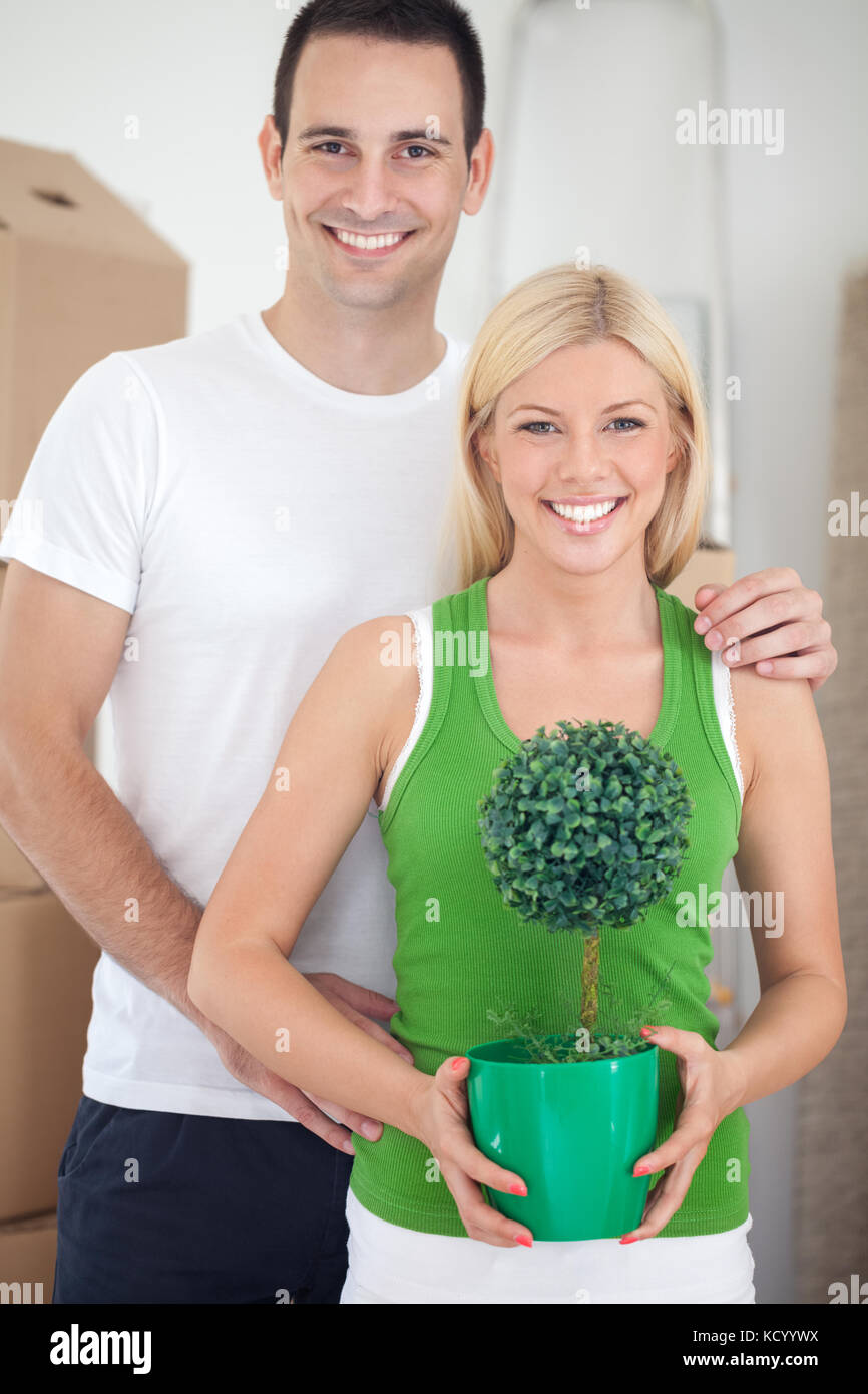 Happy young couple moving into new house Stock Photo - Alamy