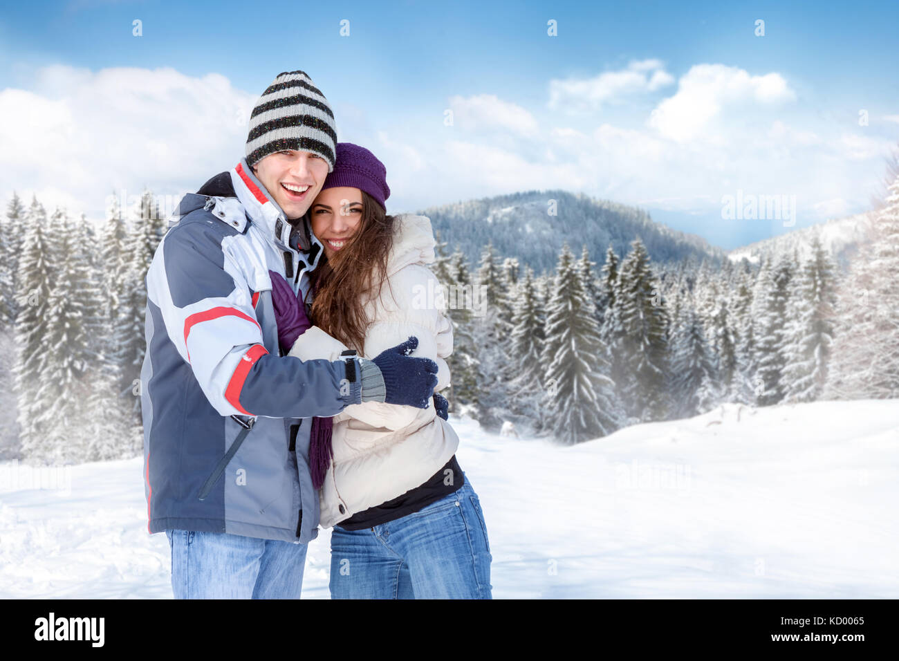 Young couple standing outside in snowy landscape Stock Photo - Alamy
