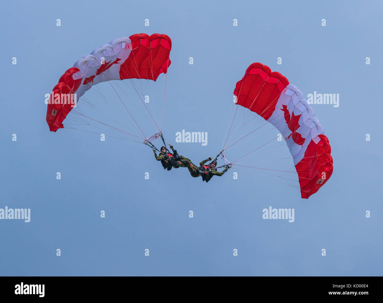 Parachuters interlocking legs at the North Bay Air Show in celebration of 150 year anniversary of Canada Stock Photo