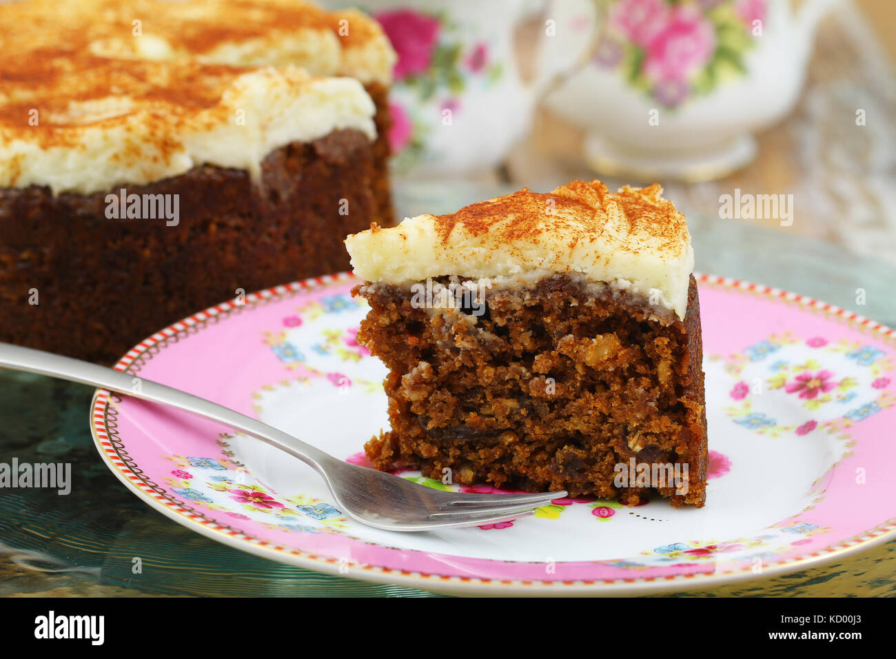 Piece of delicious walnut and carrot cake on colorful plate Stock Photo