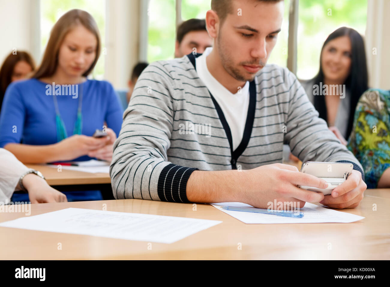 Students using phones during class Stock Photo Alamy