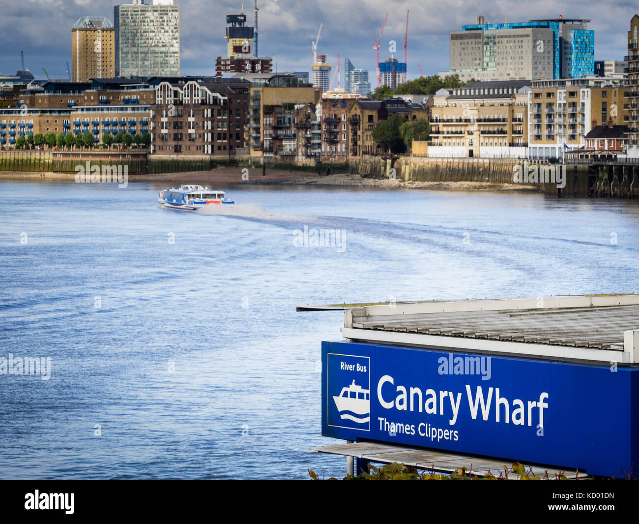 London River Bus Thames Clipper River Bus boat leaves Canary Wharf quay in East London heading towards Central London Stock Photo