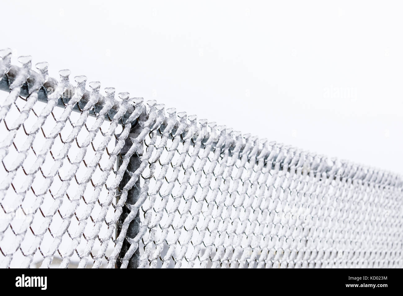 Ice covered chain link fence, after an ice storm, Thunder Bay, Ontario, Canada Stock Photo