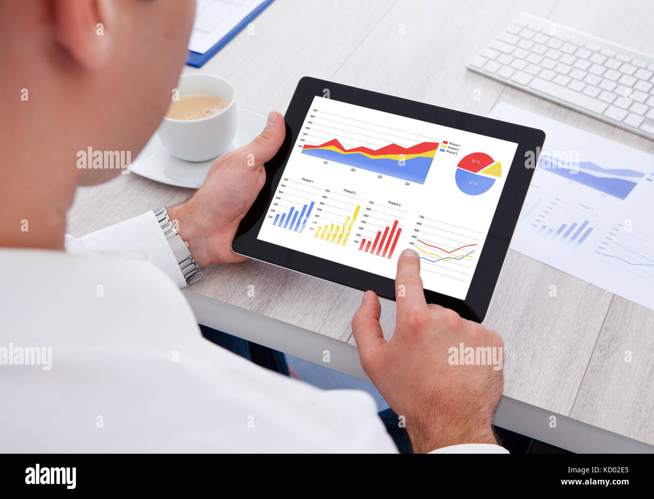 Close-up Of Businessman Analyzing Graph On Digital Tablet Stock Photo ...