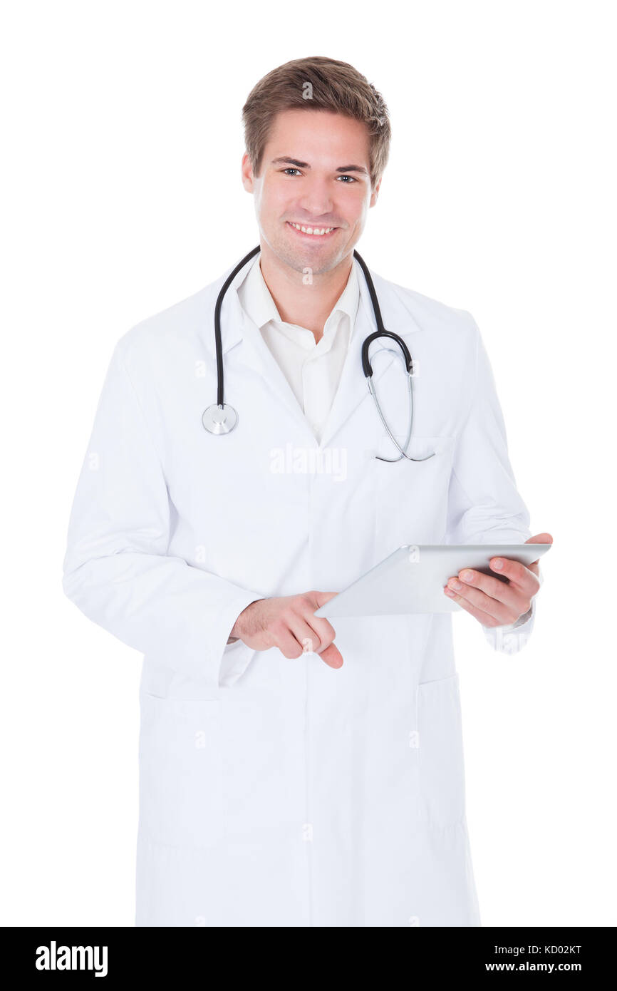Happy Young Doctor Using Tablet Over White Background Stock Photo - Alamy