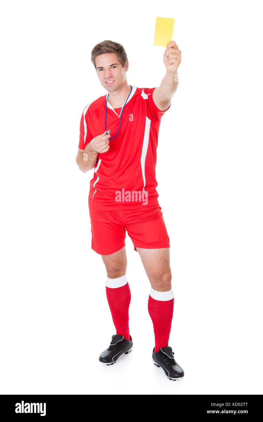 Referee Holding Up A Red Card And Whistle Inside A Stadium Stock Photo -  Download Image Now - iStock
