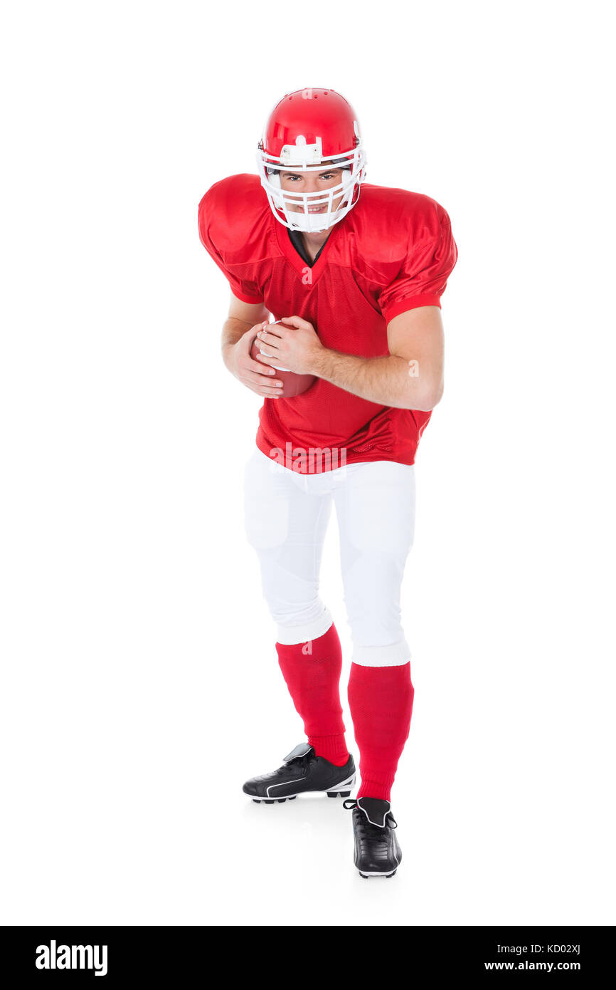 Portrait Of Rugby Player In Ready Position On White Background Stock Photo