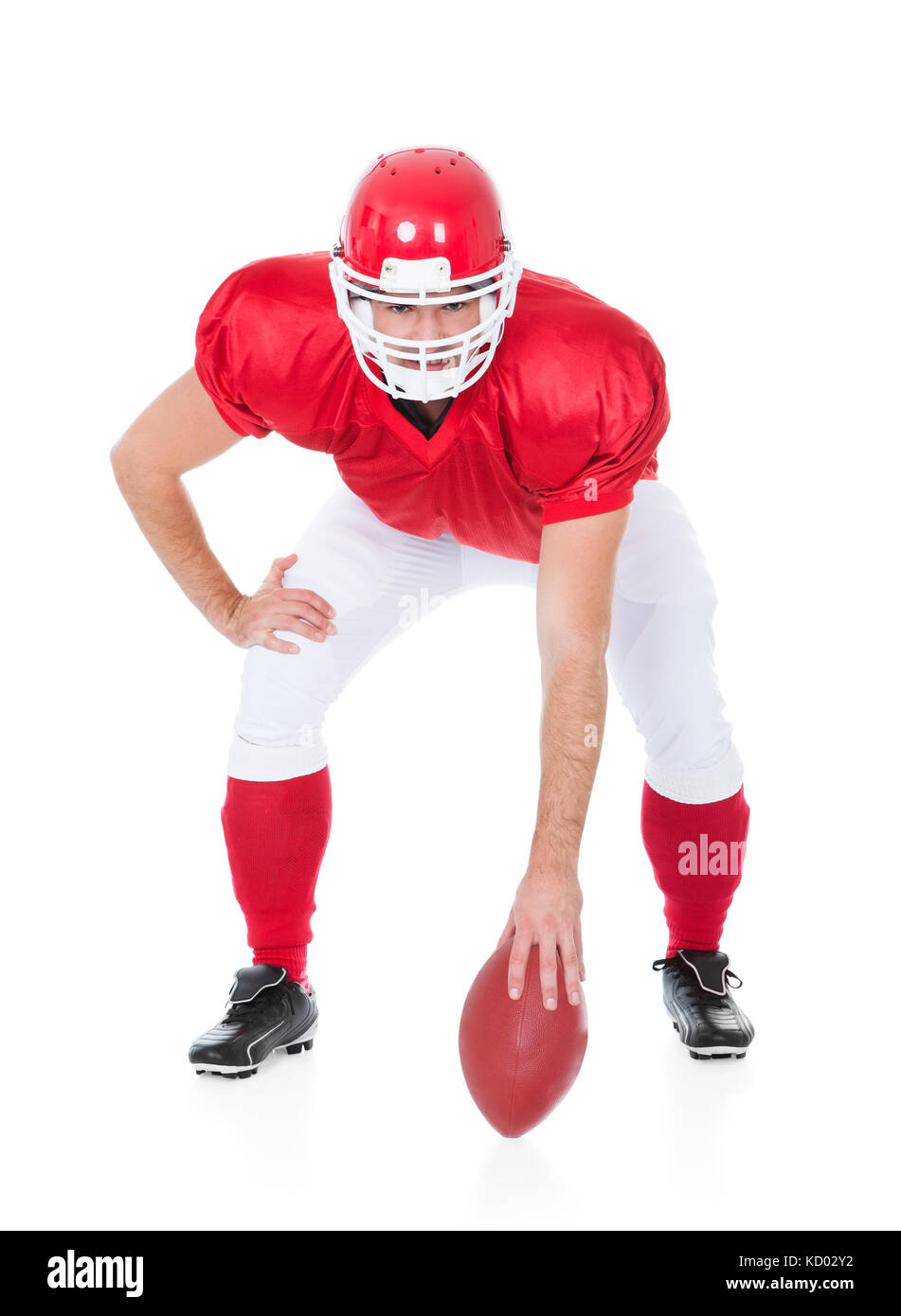 Portrait Of Rugby Player In Ready Position On White Background Stock Photo