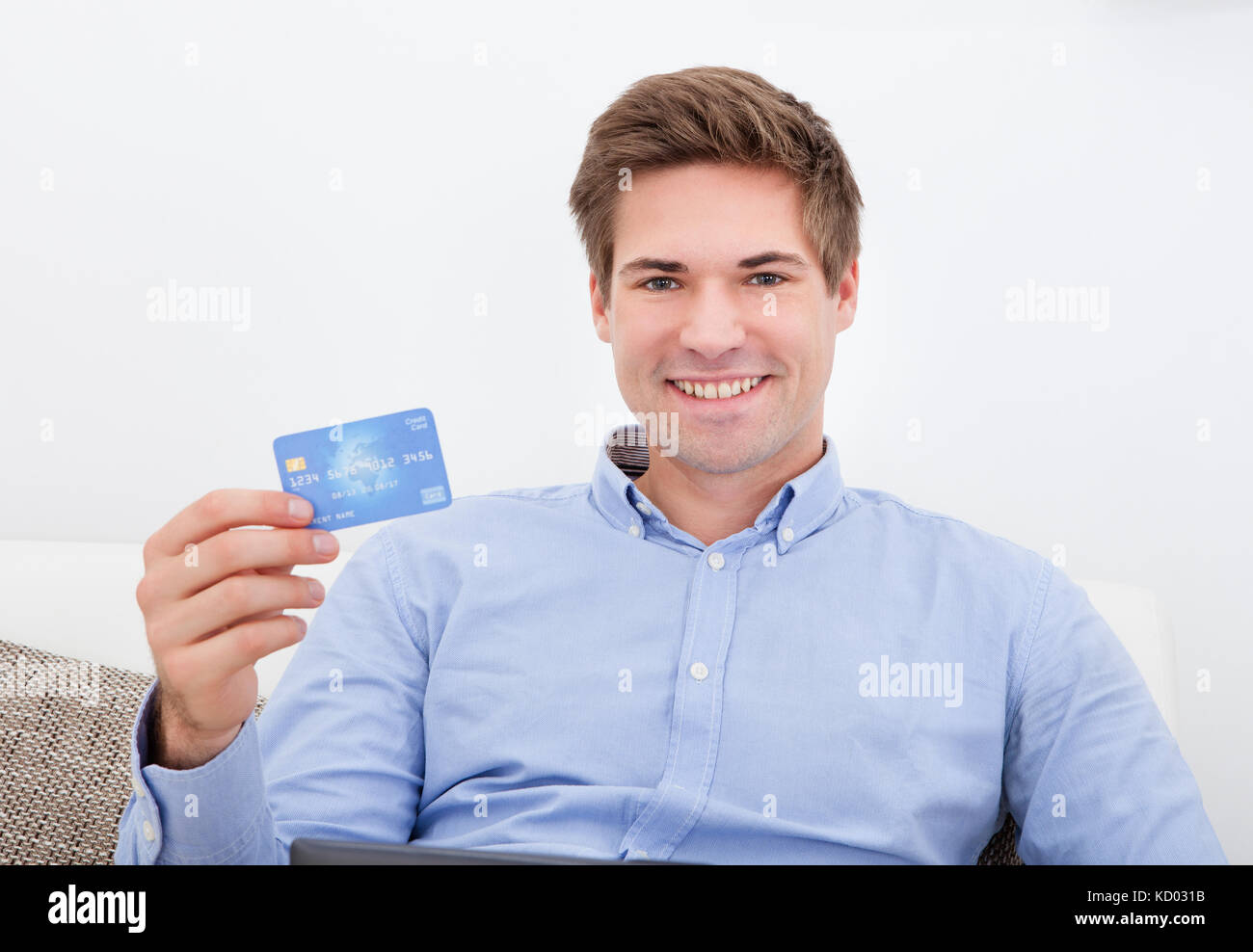 Man Shopping Online From Home Using Credit Card Stock Photo - Alamy