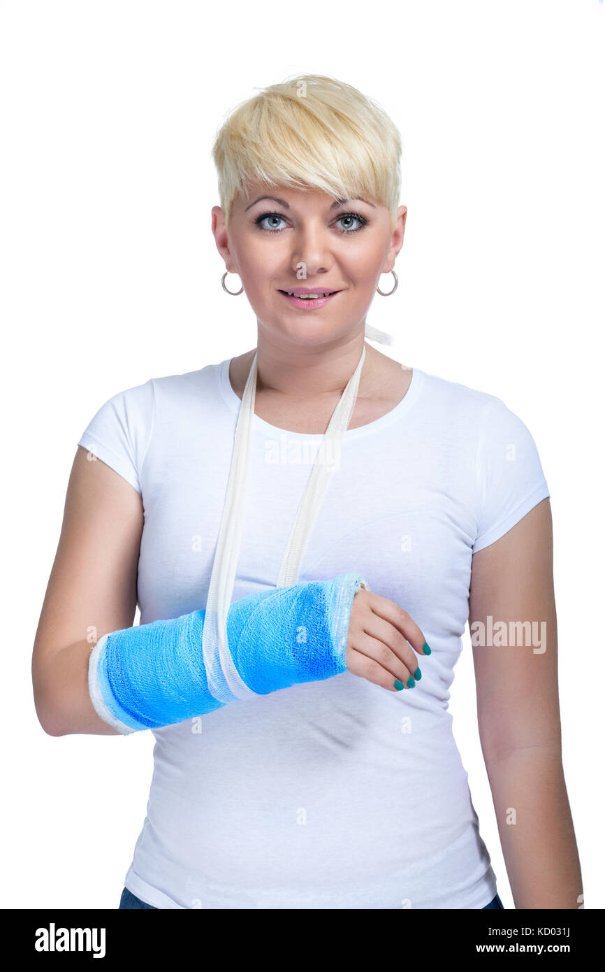 Female patient with broken arm in cast on a white background Stock