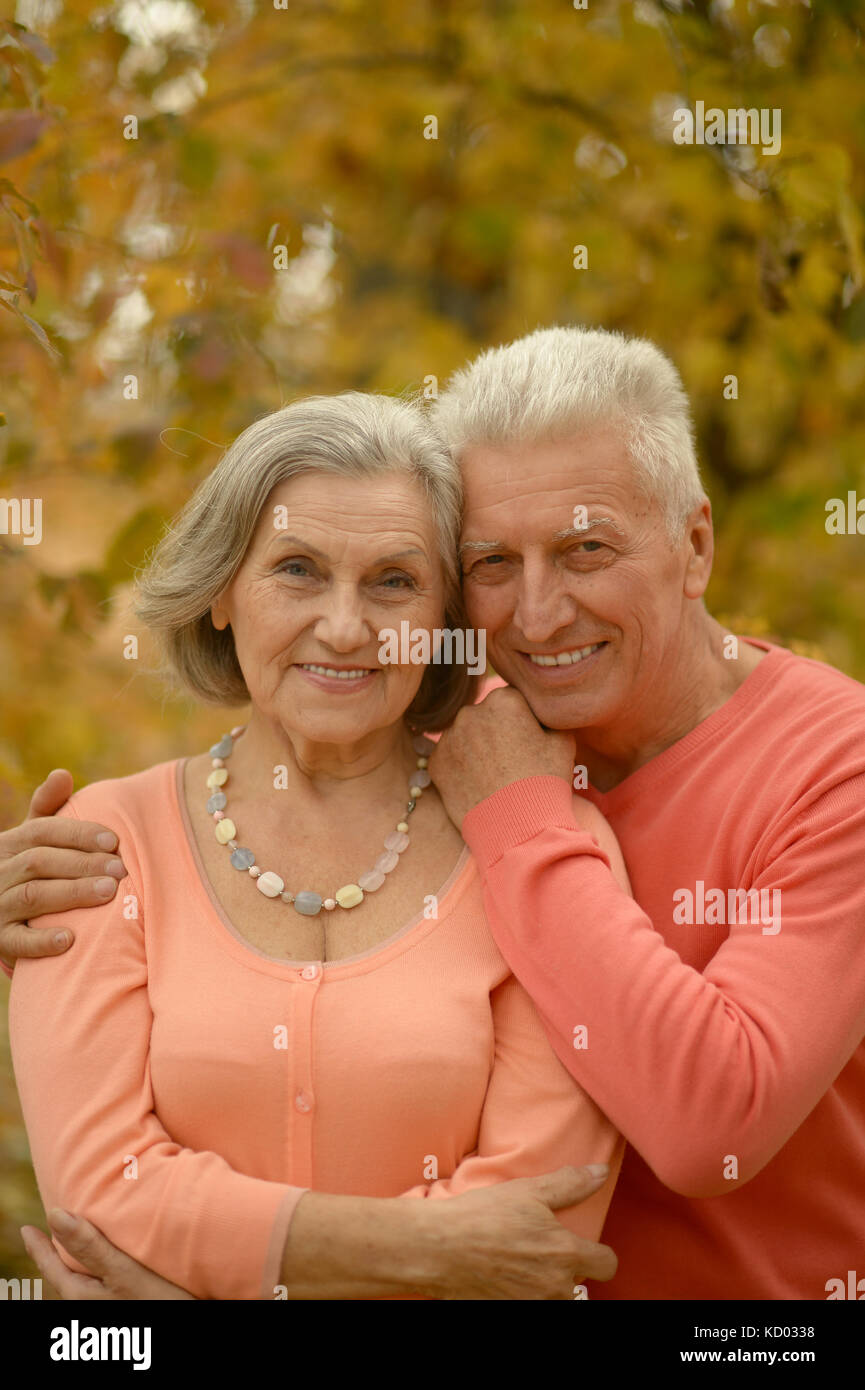 senior couple hugging in the park Stock Photo - Alamy