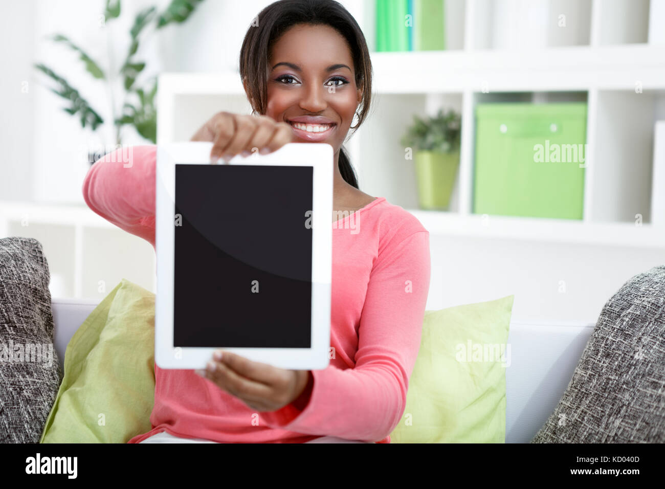 African woman holding tablet pc, empty screen Stock Photo - Alamy