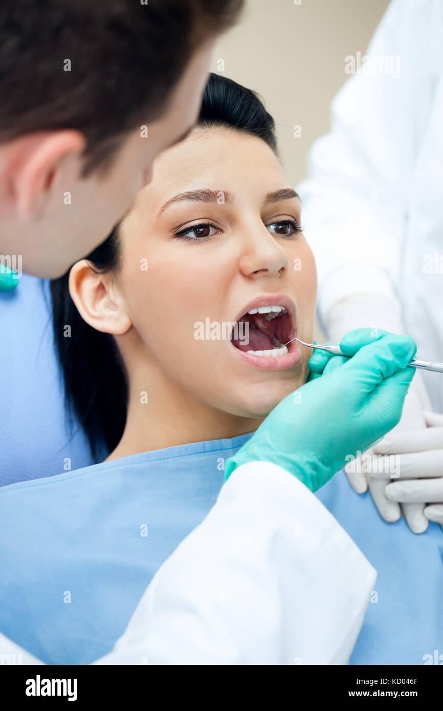 Dental care concept dentist checking patient's teeth Stock Photo Alamy