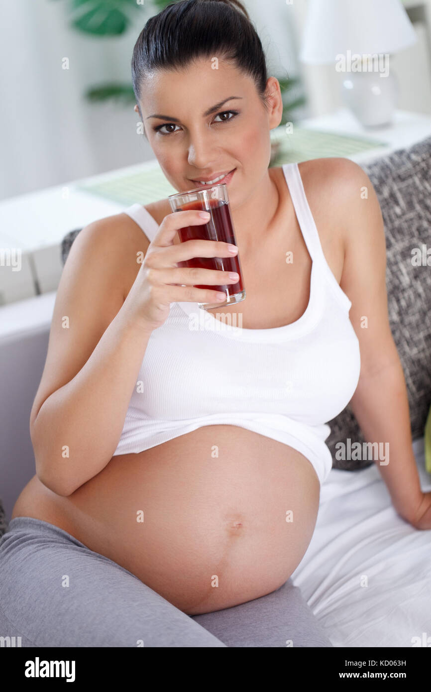 smiling pregnancy drinking healthy blackberries juice, good for anemia