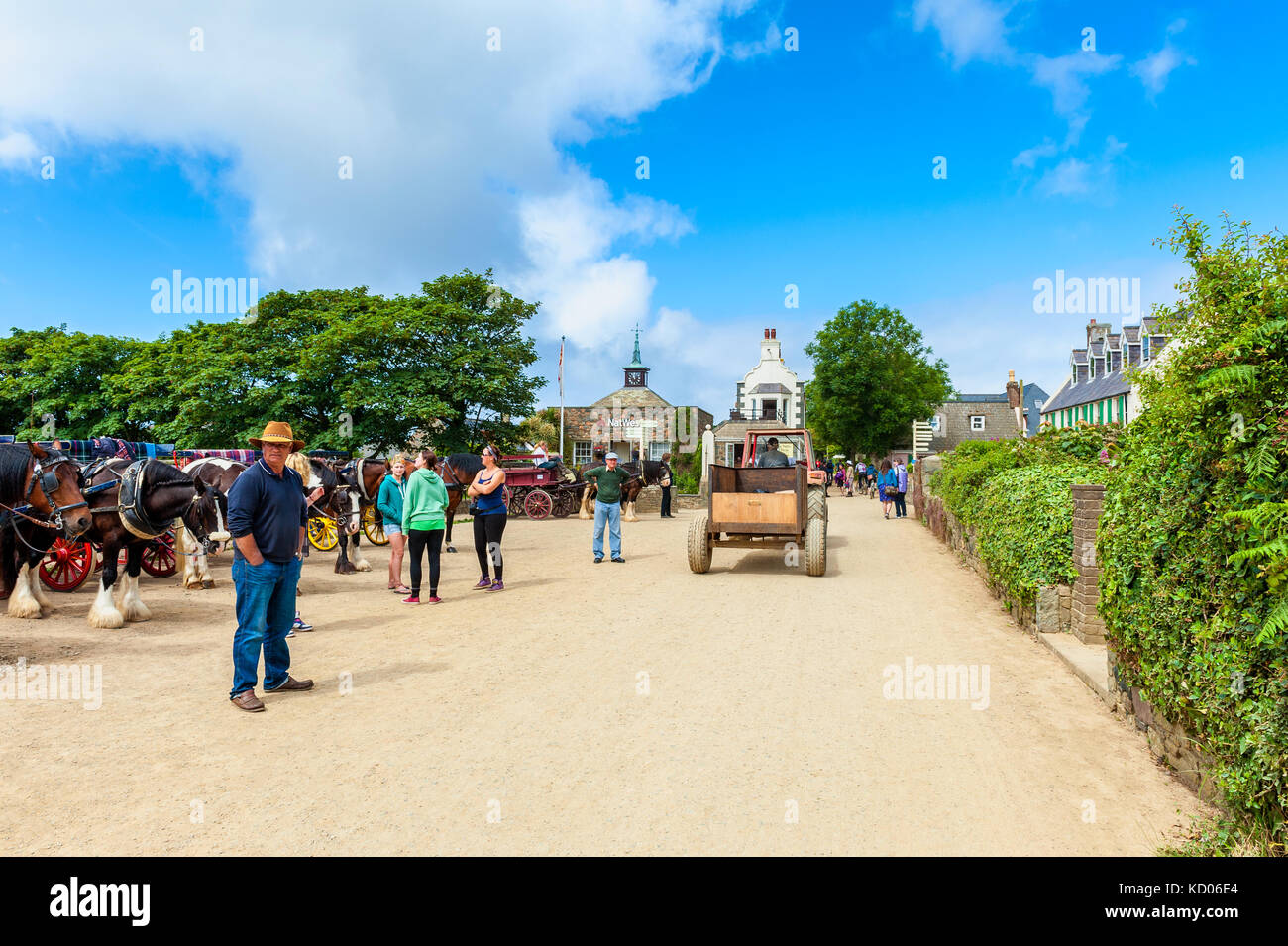 Unpaved street with Horse Carriages in The Village, the center of Sark, Channel Islands, UK. No cars or trucks are allowed on Sark. Stock Photo