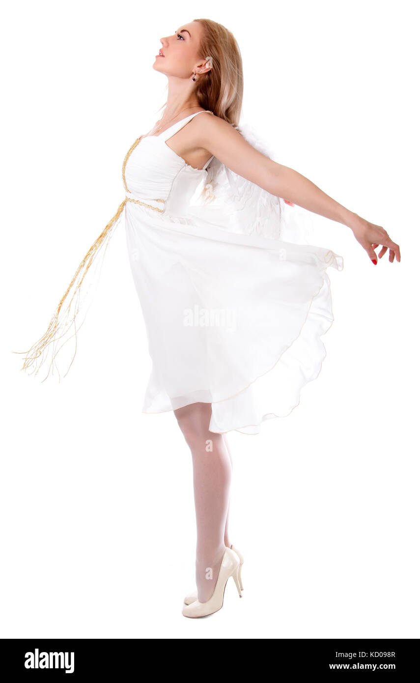 Beautiful young woman in a white dress with angel wings isolated over ...