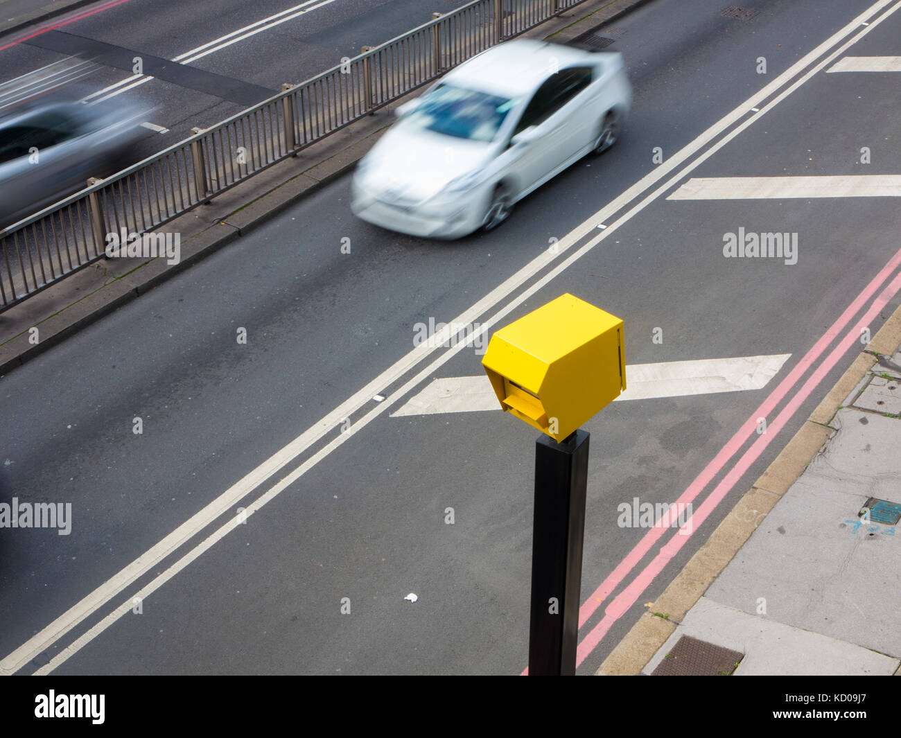 A car speeding through a speed trap in London Stock Photo