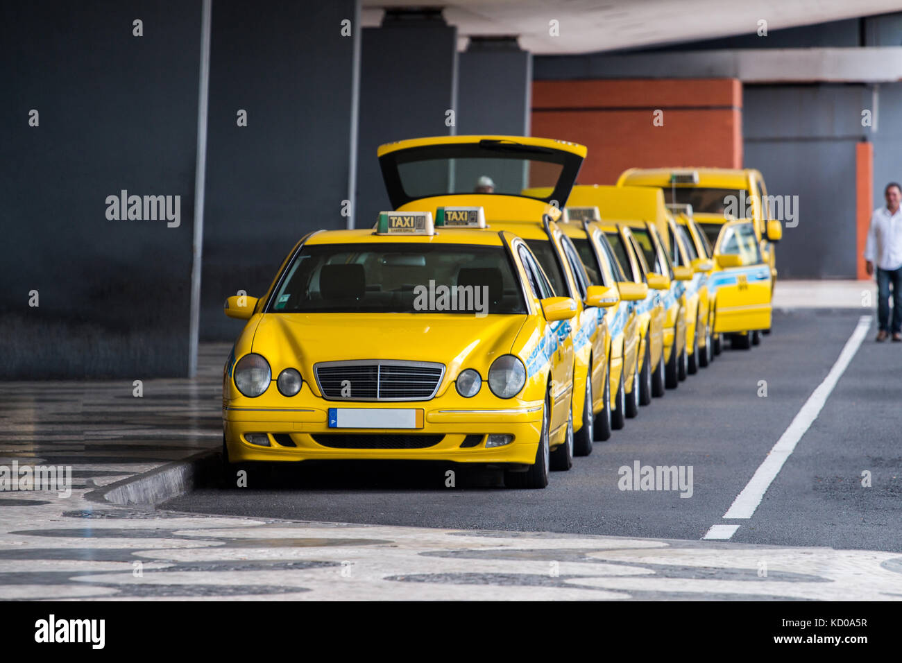 Row of Yellow taxis in Madeira island Stock Photo Alamy