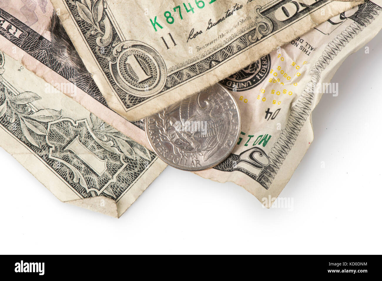Wrinkled dollar bills and a quarter adding up to $7.25, the current (as of 2016) U.S. Federal Minimum wage. Stock Photo