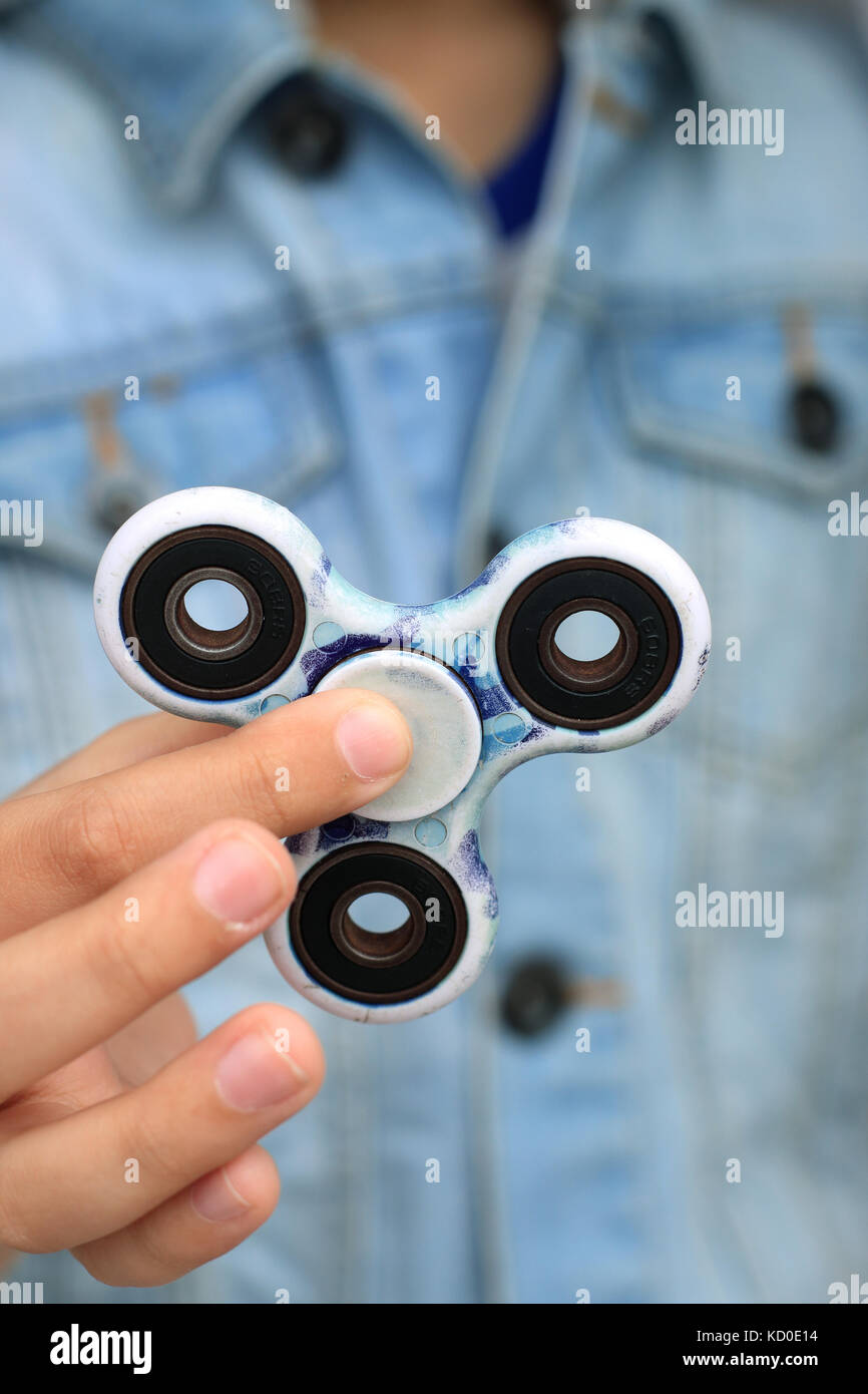 Close up of hand holding fidget spinner Stock Photo Alamy