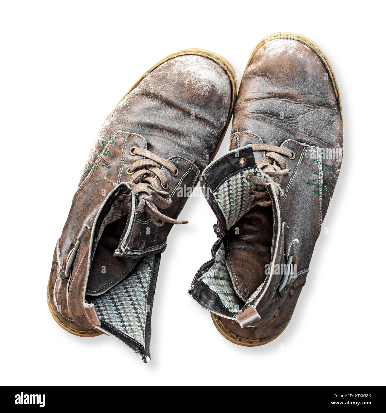Pair of old used worn out boots isolated on white background. High angle overhead view Stock Photo