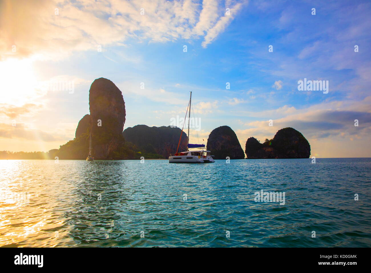 Yacht sailing on sea by cliff, Krabi, Thailand, Asia Stock Photo