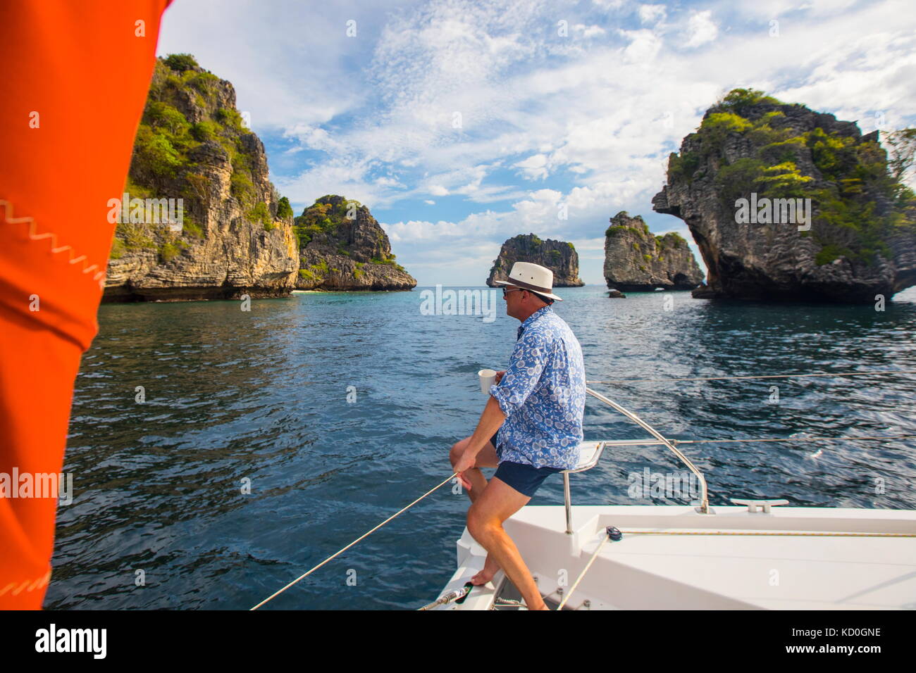 Man relaxing on yacht looking away at Koh Li Ma, Thailand, Asia Stock Photo
