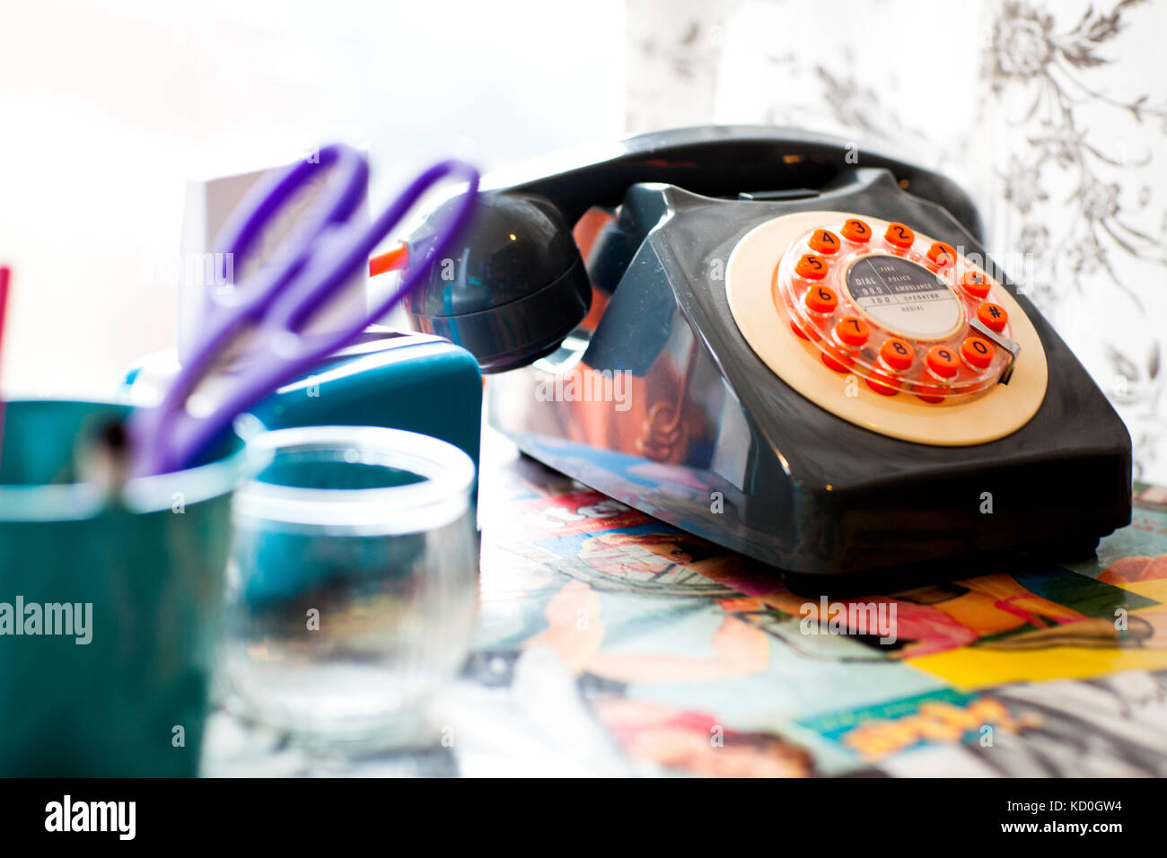 Old fashioned telephone on the reception desk of quirky hair salon Stock Photo