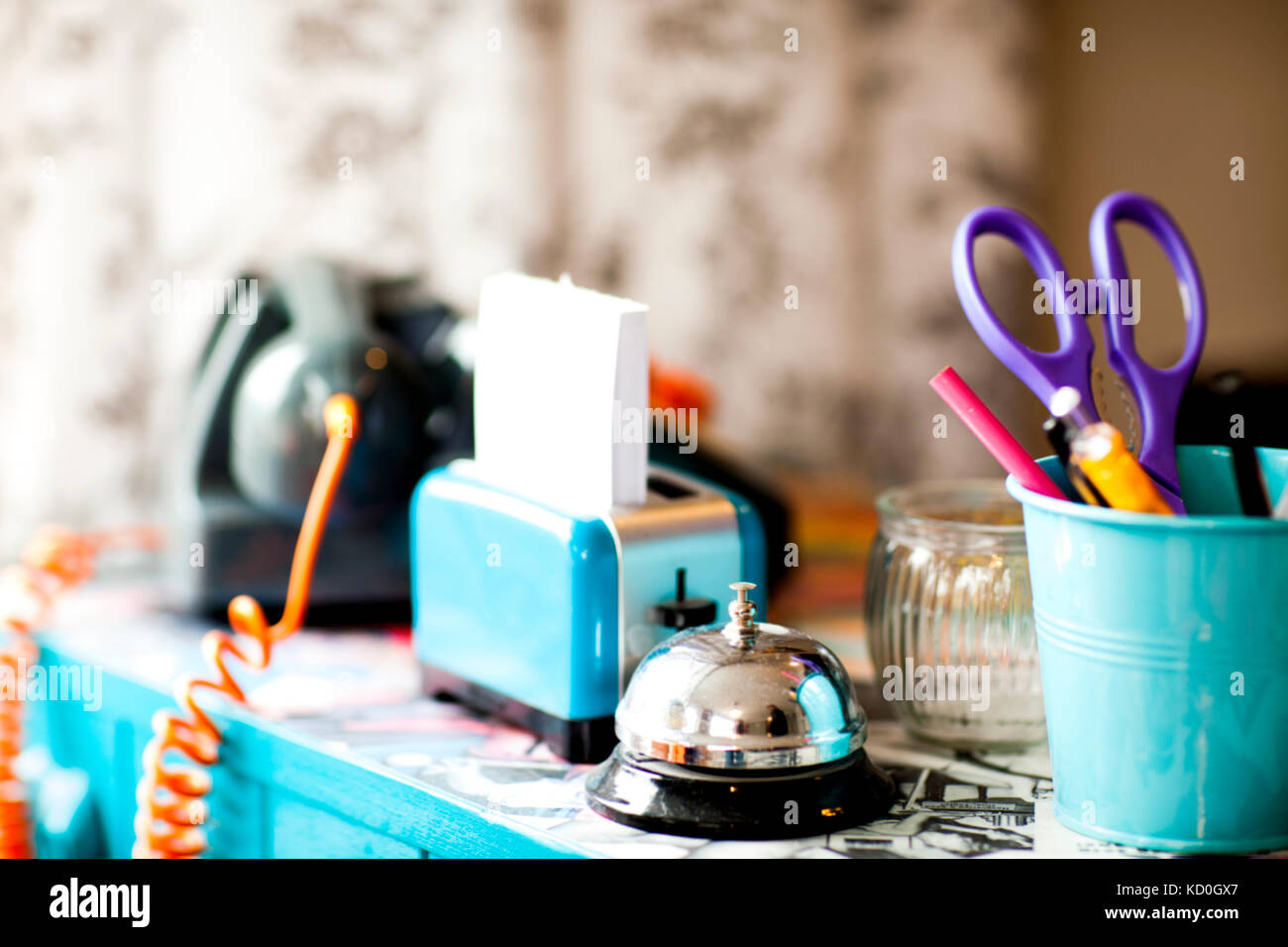 Stationery and service bell on reception desk of quirky hair salon Stock Photo