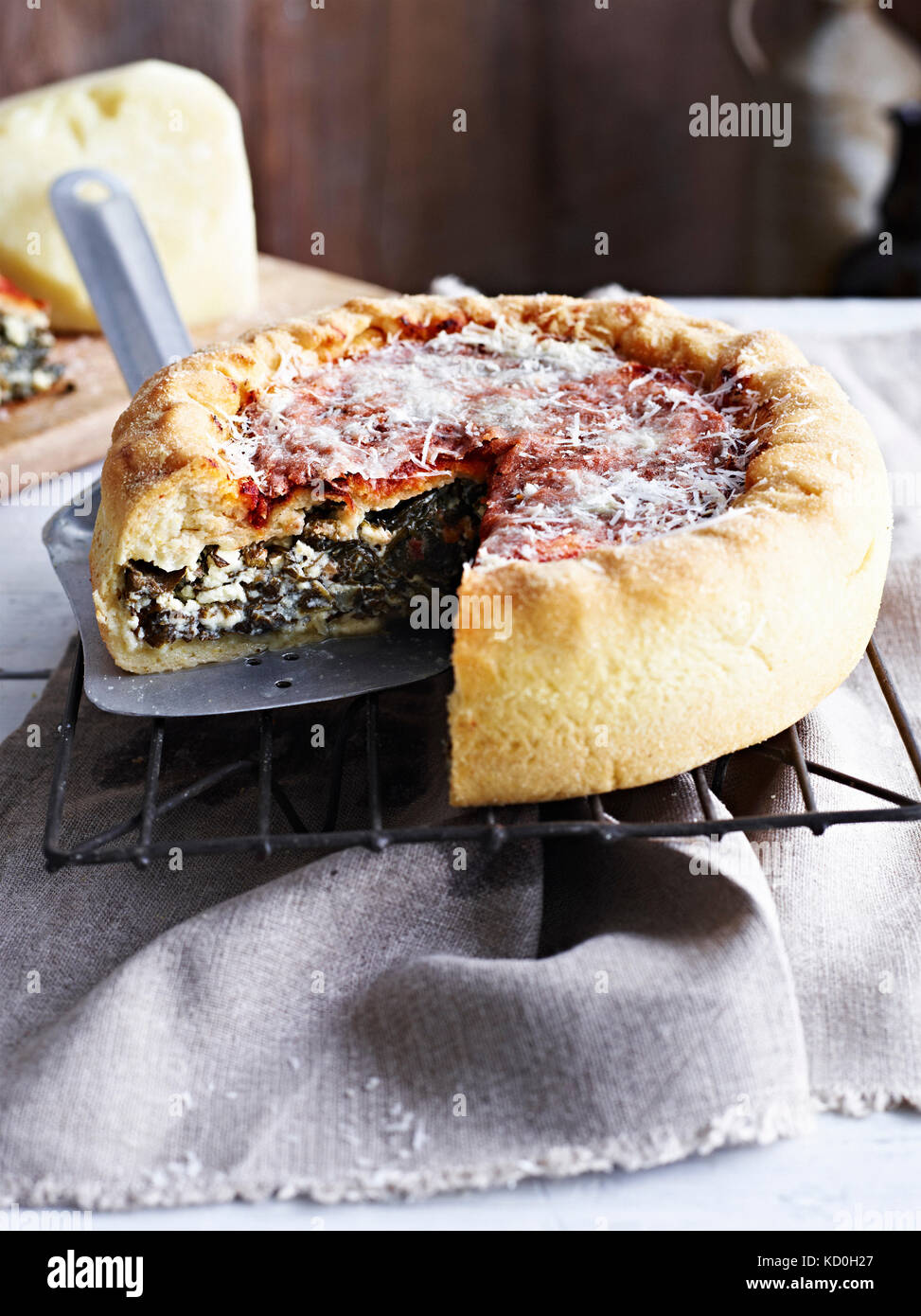 Chicago deep dish pizza, on cooling rack, closeup Stock Photo Alamy