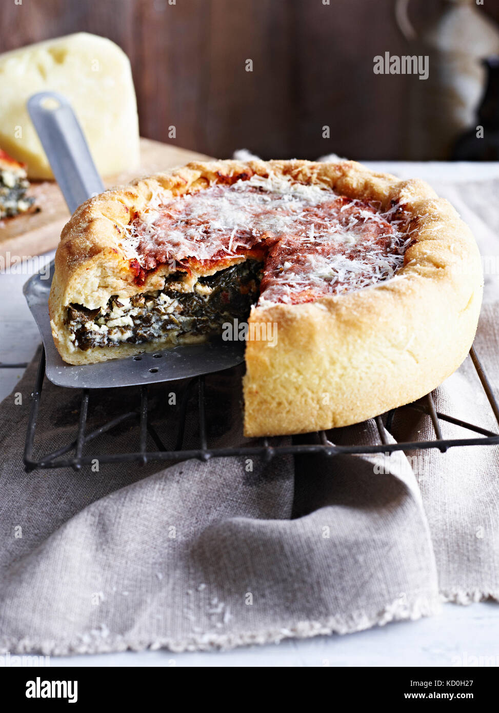 Chicago deep dish pizza, on cooling rack, close-up Stock Photo - Alamy