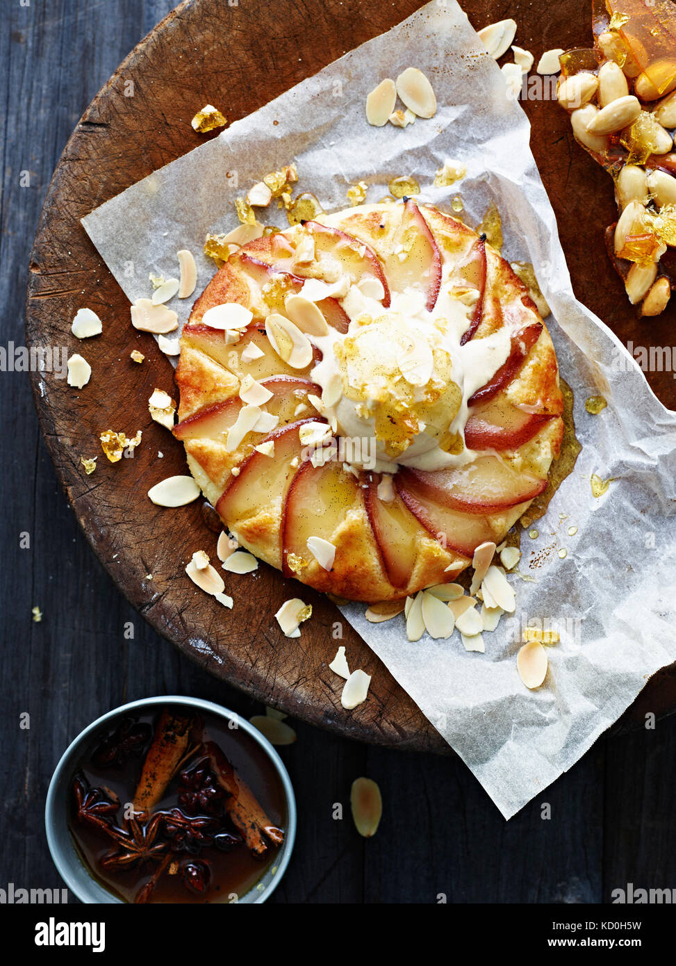 Poached pear frangipane on serving plate, overhead view Stock Photo