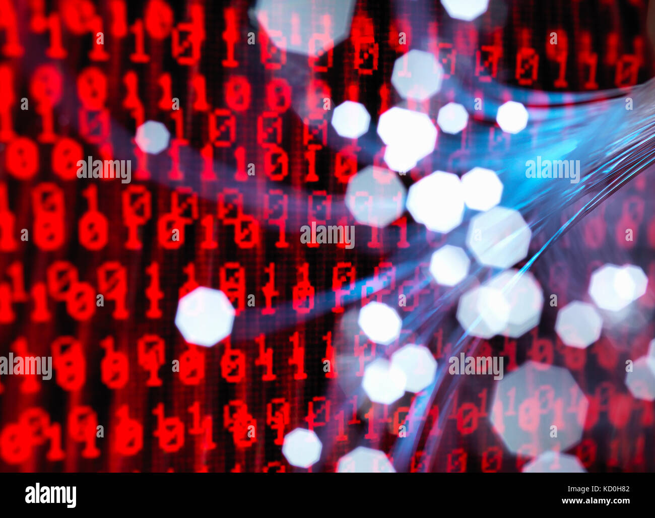 Fibre optics carrying data attacking a laptop computer which has a virus Stock Photo