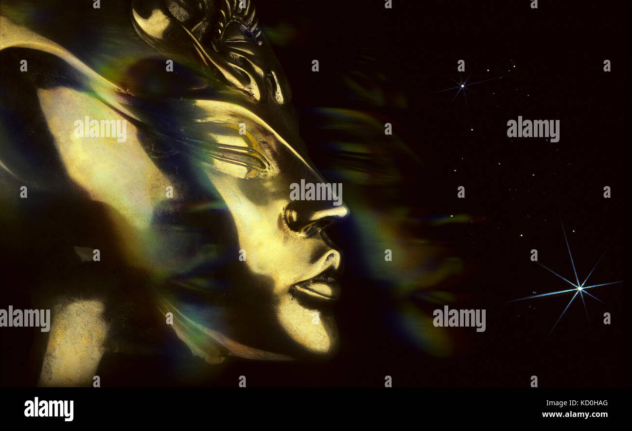 A surreal composite image of an alien head in space. Stock Photo