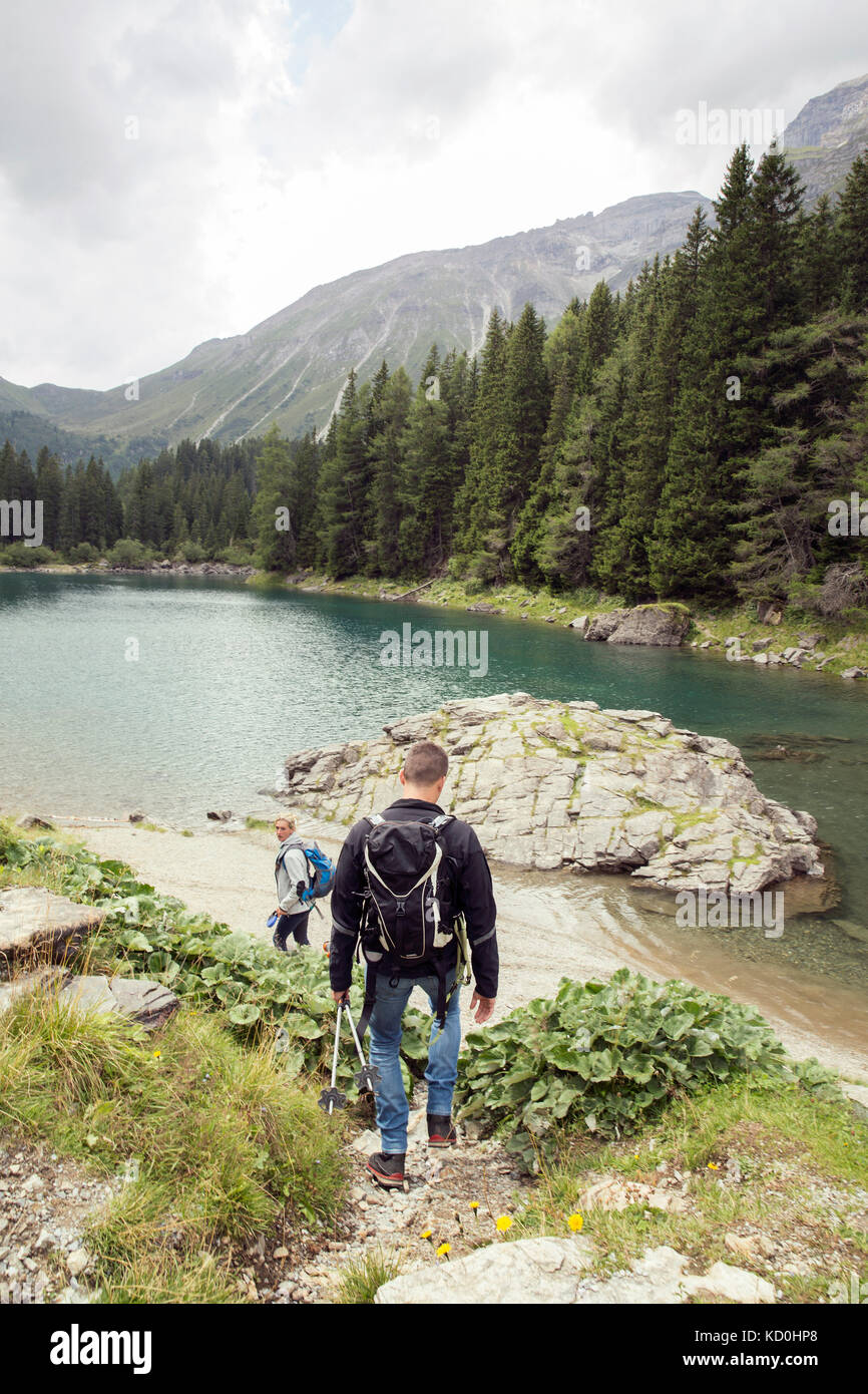 Couple hiking by lake, Tirol, Steiermark, Austria, Europe Stock Photo