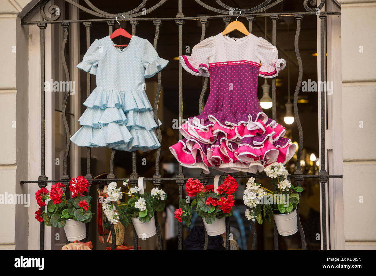 Flamenco dresses hanging on gate, Valencia, Spain, Europe Stock Photo