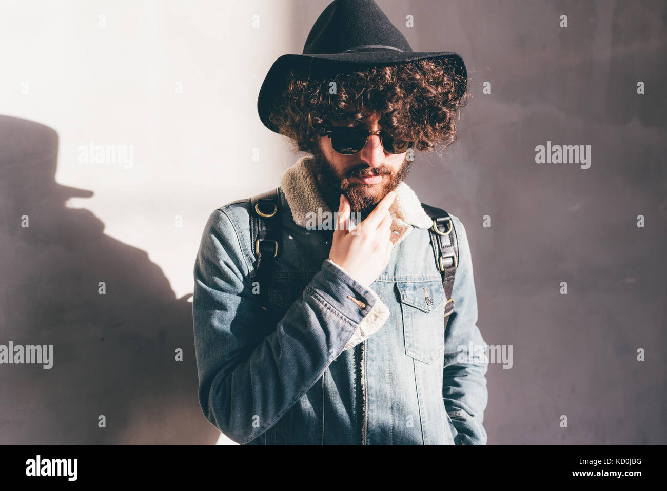 Young man curly dark beard hi-res stock photography and images - Alamy