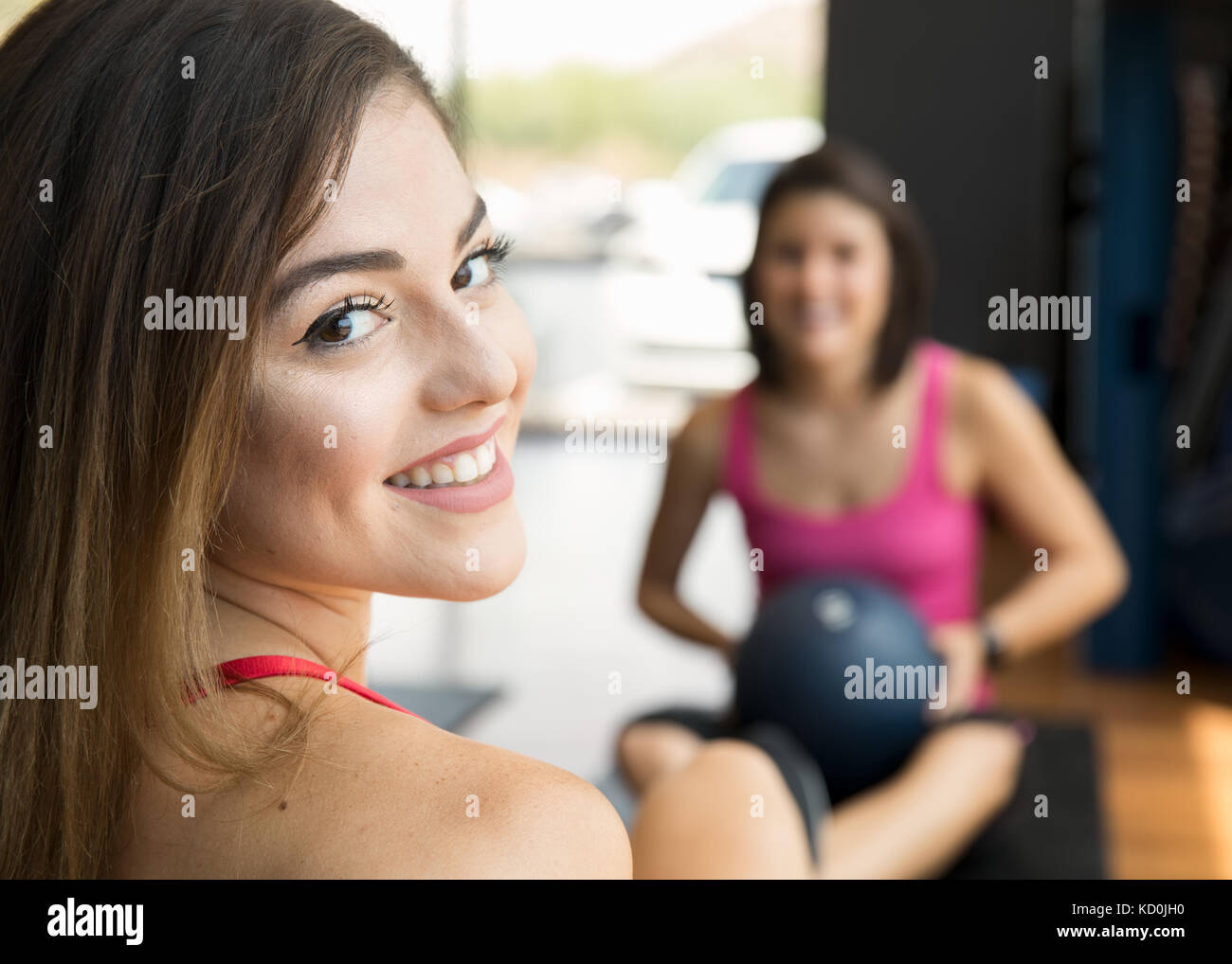 Women training with medicine ball in gym Stock Photo