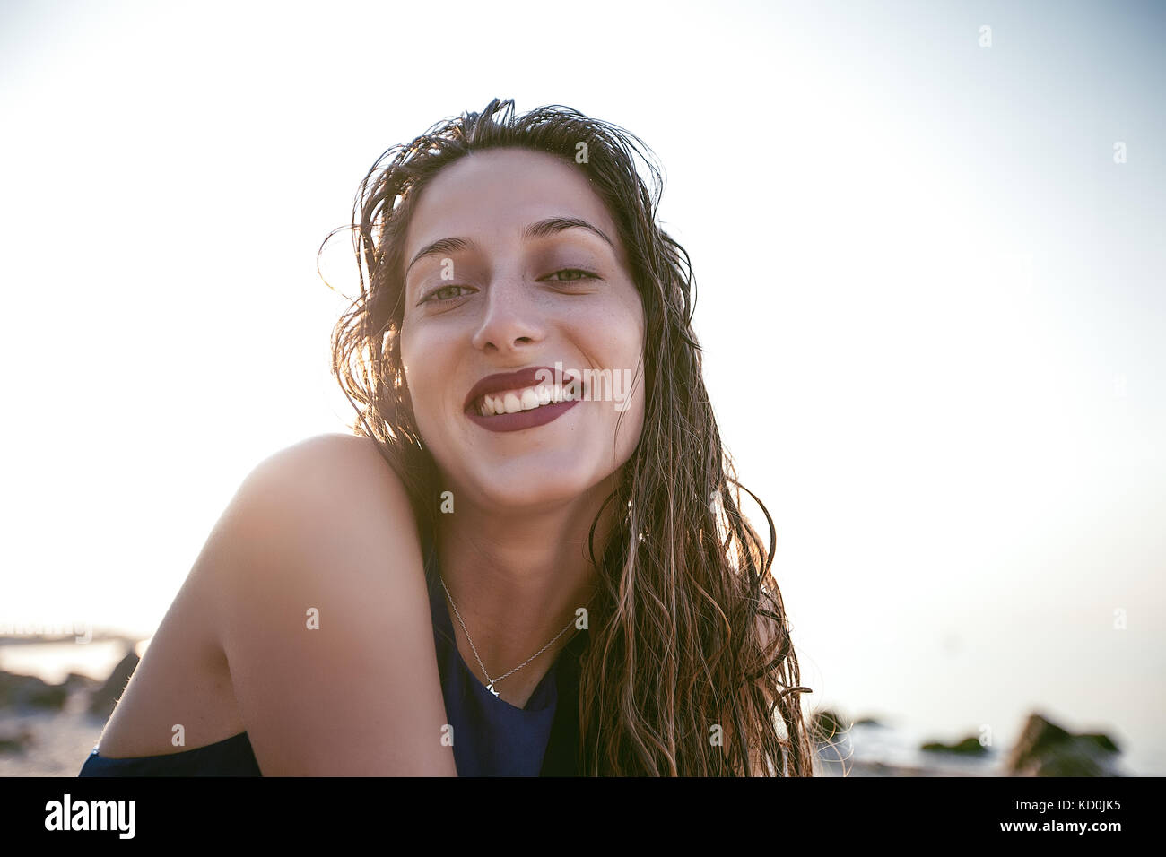 Portrait of happy young woman on beach, Odessa, Ukraine Stock Photo