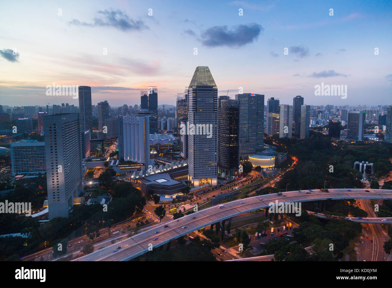 Elevated cityscape with highway and skyscrapers at dusk, Singapore, South East Asia Stock Photo