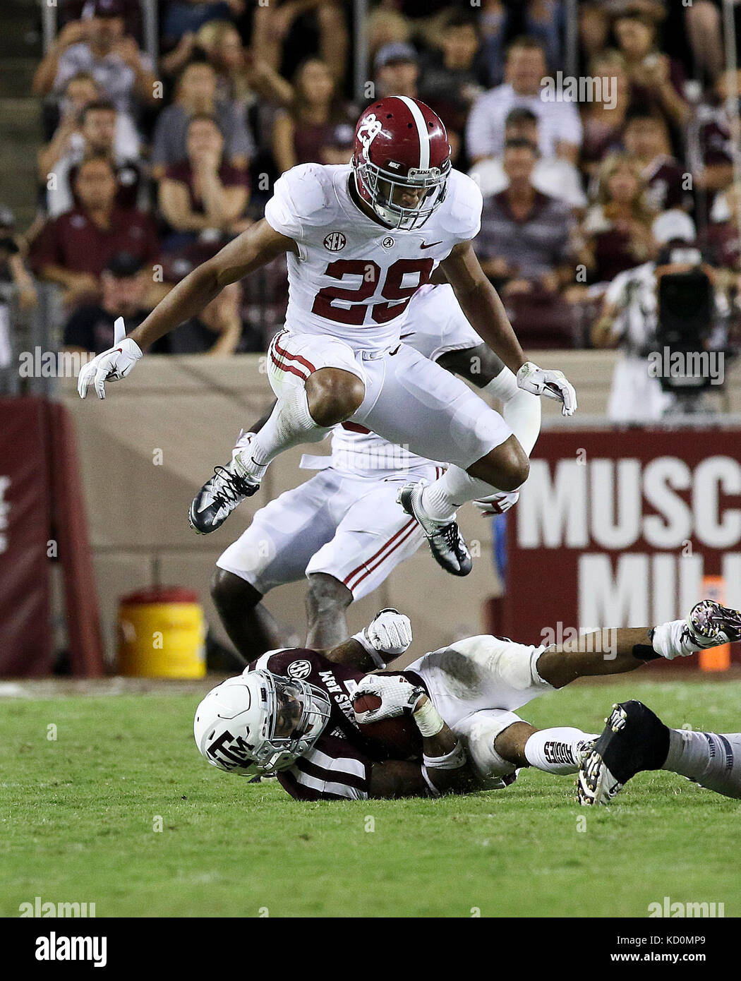 October 6, 2017: Alabama Crimson Tide defensive back Minkah Fitzpatrick (29) leaps over Texas A&M Aggies running back Trayveon Williams (5) during the NCAA football game between the Alabama Crimson Tide and the Texas A&M Aggies at Kyle Field in College Station, TX; John Glaser/CSM. Stock Photo
