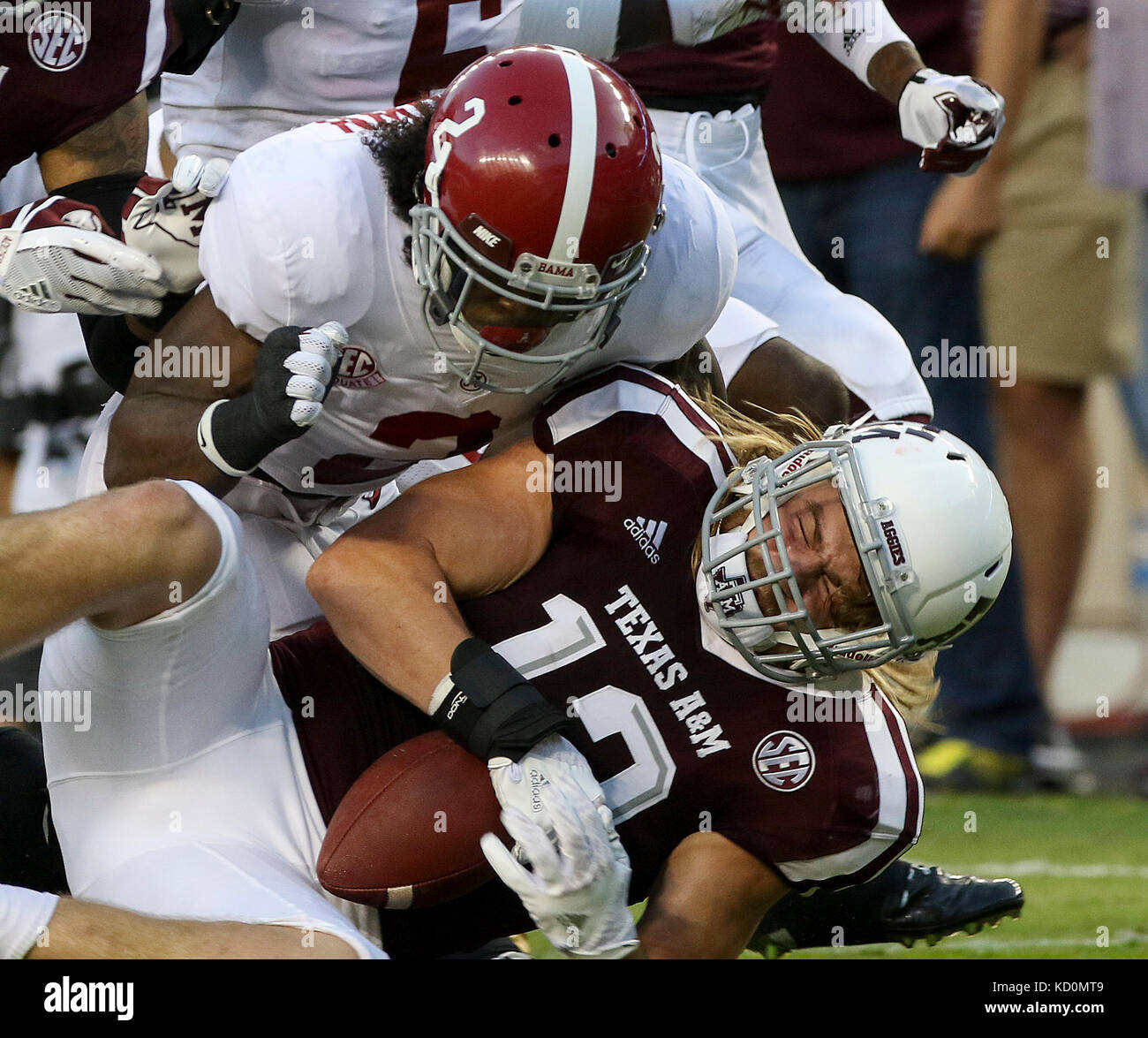 October 6, 2017: Texas A&M Aggies linebacker Cullen Gillaspia (12) recovers a fumble during the NCAA football game between the Alabama Crimson Tide and the Texas A&M Aggies at Kyle Field in College Station, TX; John Glaser/CSM. Stock Photo