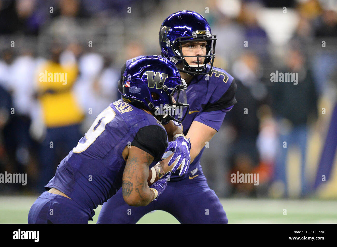 Seattle, WA, USA. 7th Oct, 2017. UW quarterback Jake Browning (3) hands off to Myles Gaskin (9) during a PAC12 football game between the Cal Bears and the Washington Huskies. The game was played at Husky Stadium on the University of Washington campus in Seattle, WA. Jeff Halstead/CSM/Alamy Live News Stock Photo
