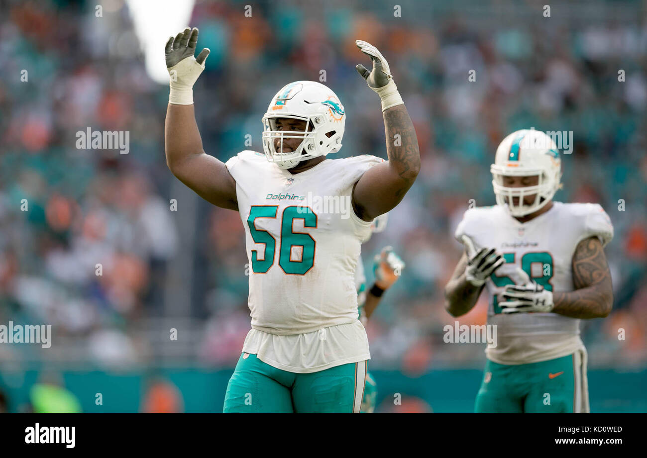 Miami Dolphins defensive tackle Davon Godchaux (56) reacts after