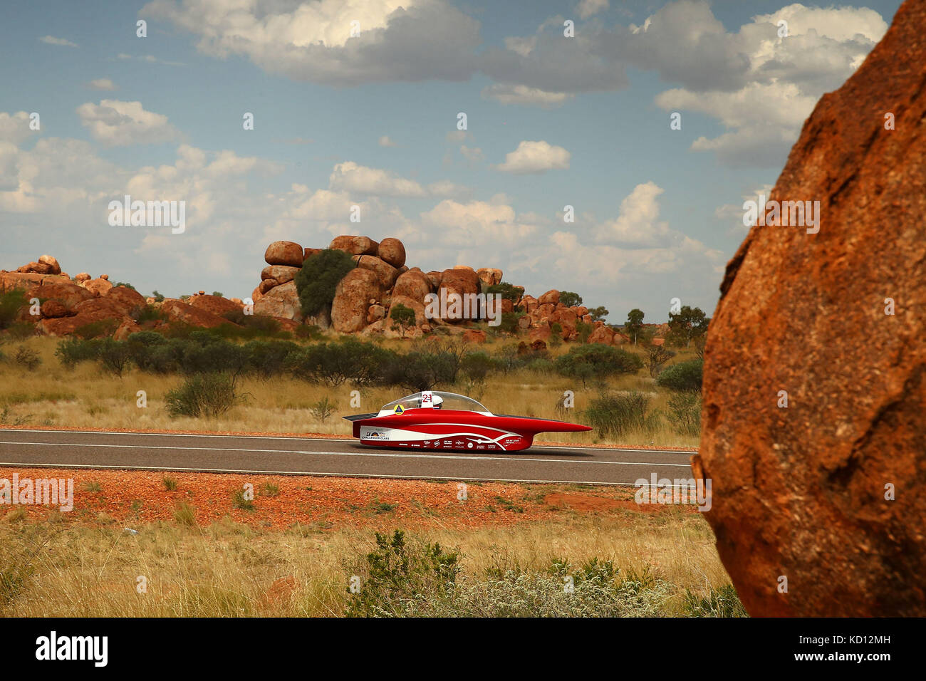 Canberra. 9th Oct, 2017. Solar car Red Shift by the Univesity of Twente of the Netherlands races pass Devil's Marble during the second day match of 2017 World Solar Challenge in Canberra, Australia on Oct. 9, 2017. Credit: 2017 Bridgestone World Solar Challenge/Xinhua/Alamy Live News Stock Photo
