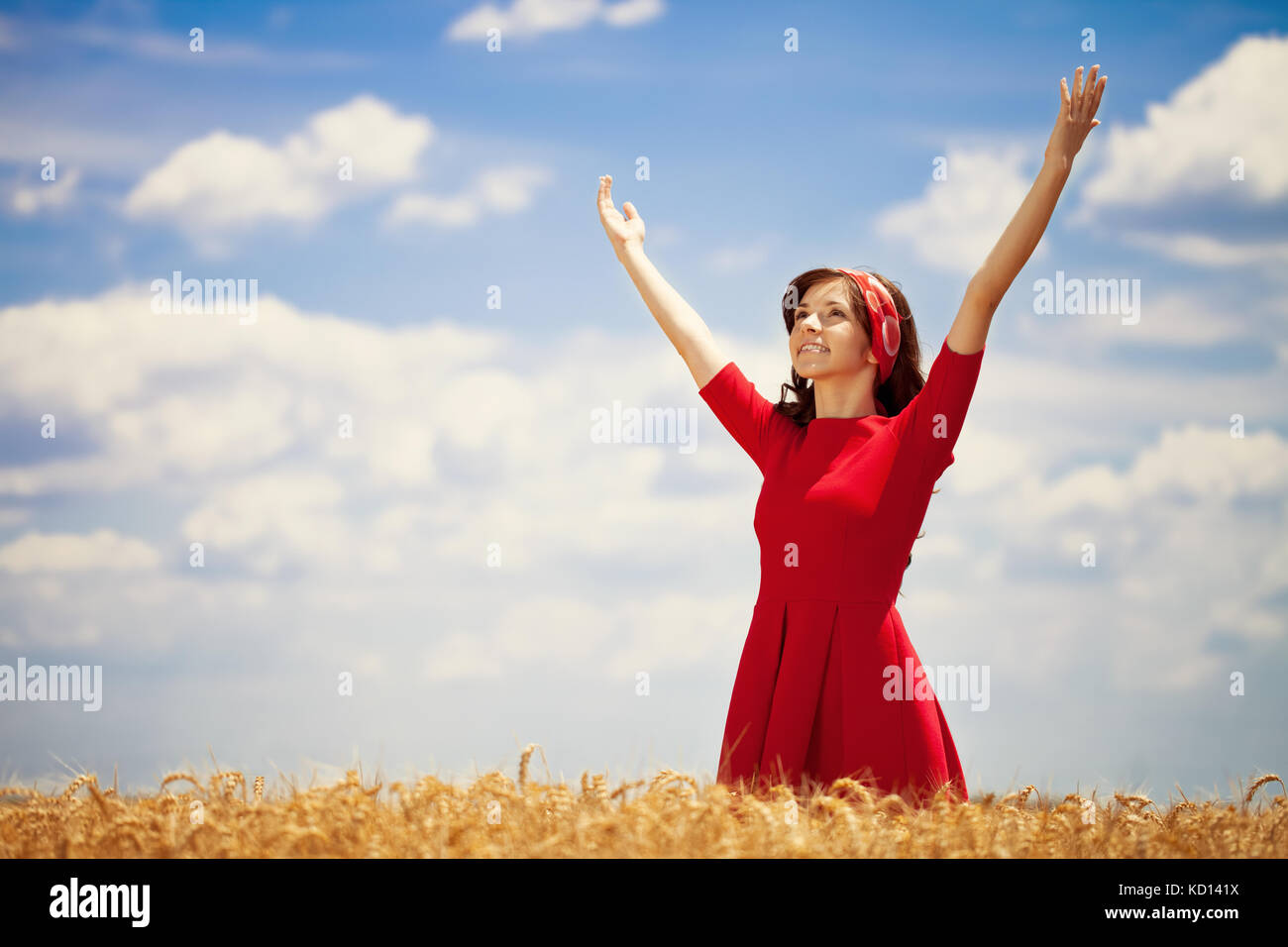 Happiness young woman standing in wheat field Stock Photo - Alamy